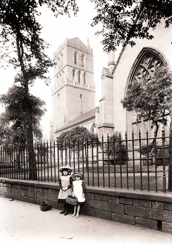 Two Small Girls in front of Old Steeple